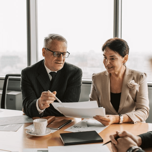 Openfair advisors reviewing a business sale plan with an owner